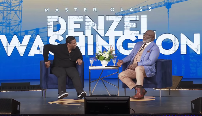 Denzel Washington speaks with Bishop T.D. Jakes at the International Leadership Summit in Charlotte, North Carolina, on April 2, 2022. 