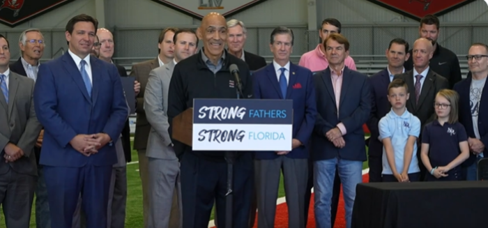 Retired NFL coach Tony Dungy speaks at a signing ceremony for Florida's House Bill 7065, which allocates $70 million to the promotion of responsible fatherhood in Tampa, Florida, April 11, 2022.