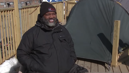 New Beginnings Church Senior Pastor Corey Brooks speaks with the media while camping out on a rooftop in Chicago, Illinois. 