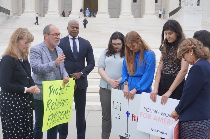 Demonstrators gathered to pray outside the Supreme Court in Washington, D.C. in support of football coach Joe Kennedy on April 25, 2022.