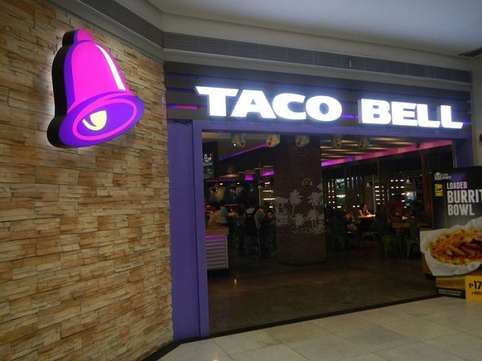 People eat at a Taco Bell in Manilla, Philippines, in this undated file photo. 