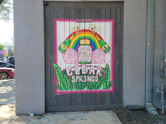 The Exterior of Mr. Misster gay bar in Dallas, Texas, with the words 'It's Not Gonna Sniff Itself'