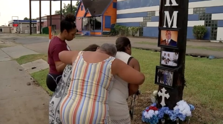 Church members grieve at a memorial for the late Rev. Ronald K. Mouton of East Bethel Missionary Baptist Church in Houston, Texas.