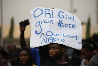 Christians hold signs as they march on the streets of Abuja during a prayer and penance for peace and security in Nigeria in Abuja on March 1, 2020. The Catholic Bishops of Nigeria gathered faithfuls and other Christians to pray for security and to denounce the barbaric killings of Christians by the Boko Haram insurgents and the incessant cases of kidnapping for ransom in Nigeria. 