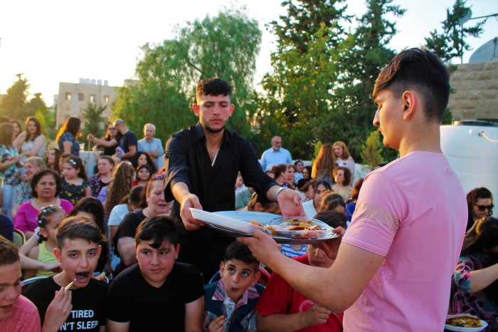 People celebrate Iraqi culture at the Olive Tree Center in Madaba, Jordan