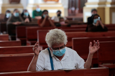 A woman prays during a mass at the Matagalpa Cathedral in Matagalpa, Nicaragua, on August 19, 2022. 