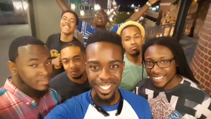 Former elder Robert Harris (C) poses with his former pastor, Carlton Funderburke (Front L) and other young men from Repairers Kansas City.