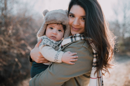 Maddie Martinez, who works for the pro-life group Embrace Grace, poses for a picture with her son, Mateo. 