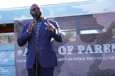 John Amanchukwu speaks during a protest outside the Loudoun County Public Schools headquarters in Broadlands, Virginia, on Sept. 13, 2022. 