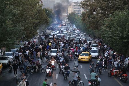 A picture obtained by AFP outside Iran on September 21, 2022, shows Iranian demonstrators taking to the streets of the capital Tehran during a protest for Mahsa Amini, days after she died in police custody. 