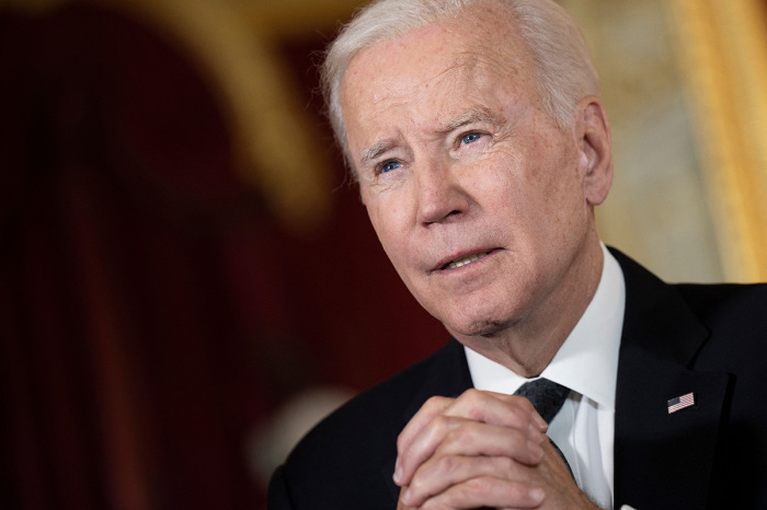 U.S. President Joe Biden speaks after signing a book of condolence at Lancaster House in London on September 18, 2022, following the death of Queen Elizabeth II on Sept. 8.