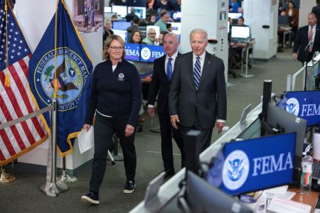 US President Joe Biden (R), Federal Emergency Management Agency (FEMA) Administrator Deanne Criswell (L) and Homeland Security Secretary Alejandro Mayorkas (C) visit FEMA headquarters in Washington, DC on Sept. 29, 2022.