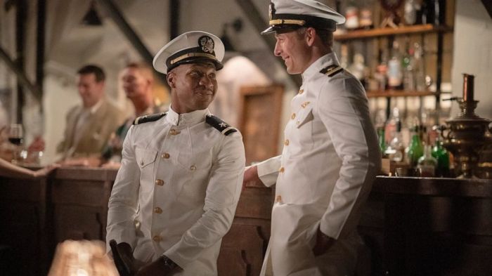 Jonathan Majors, left, and Glen Powell in a scene from 'Devotion.' 