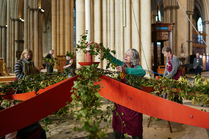 York Minster’s Flower Arrangers decorate the Minster’s Advent Wreath with seasonal foliage on Nov. 25, 2022, in York, England. The metal structure is three metres wide and will be suspended beneath the Minster’s Central Tower for the duration of Advent and Christmas. 