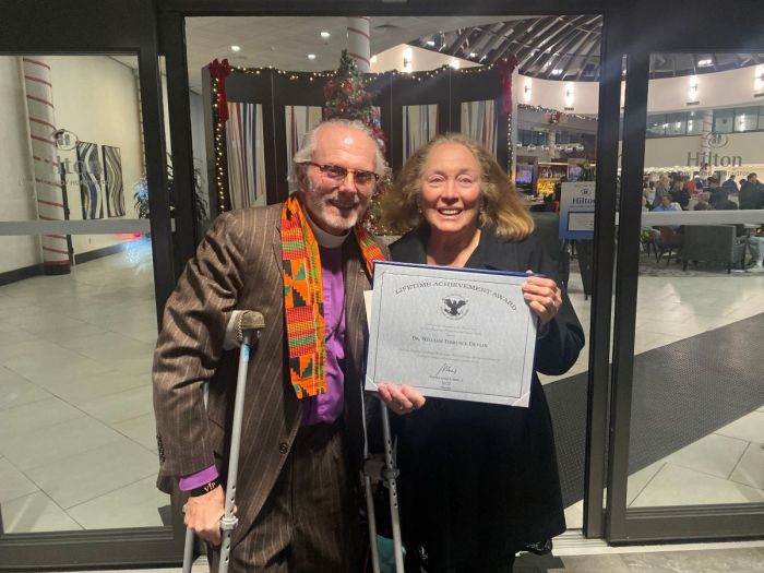 Pastor Bill Devlin (L) and his wife, Nancy, pose for a photo during President’s Volunteer Service Award ceremony in Melville, New York on Dec. 2, 2022. 