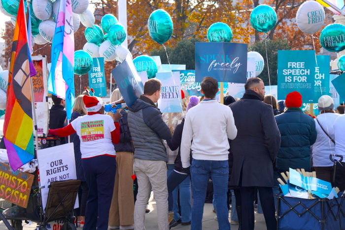 While Lorie Smith owner of 303 Creative in Colorado was having her case heard at the Supreme Court level, demonstrators could be seen lined up outside the building showing their support.