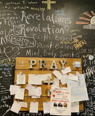 A prayer wall on display at Revelations Cafe in Tampa, Florida. 