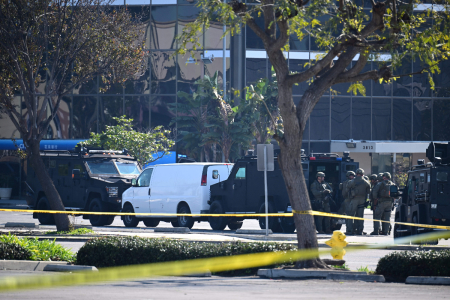 Law enforcement personnel are seen outside the site in Torrance, California, where the alleged suspect in the mass shooting in which 10 people were killed in Monterey Park, California, is believed to be holed up on Jan. 22, 2023. 