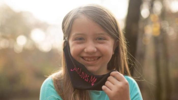 Lydia Booth was forced by her public school to remove her 'Jesus Loves Me' face mask.