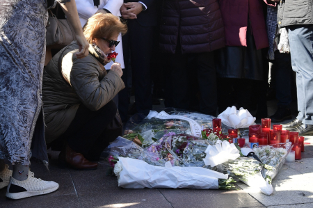 Relatives and friends of the victim react during a minute of silence near the church where a sacristan (priest's assistant) was killed the day before on Alta square in Algeciras, southern Spain, on January 26, 2023. - Spain opened a terror probe on January 25 after a man wielding a bladed weapon stormed a church in southern Spain killing a sacristan and wounding severely a priest, legal sources told AFP. 