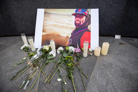 A memorial is displayed for Tyre Nichols at the Embrace statue in Boston, Massachusetts, on January 28, 2023. The city of Memphis released a graphic video, depicting the fatal police assault of Nichols, a 29-year-old Black man, on Jan. 27. Five Memphis officers, also all Black, were charged with second-degree murder in the beating of Nichols, who died in a hospital on Jan. 10, three days after being stopped on suspicion of reckless driving. 