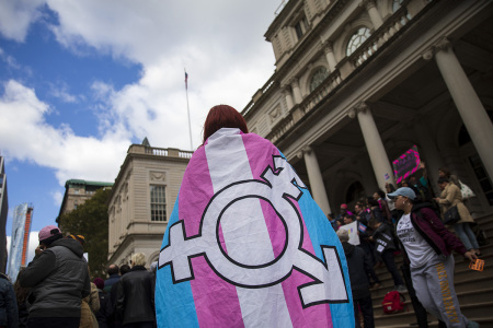 Trans activists and their supporters rally in support of transgenderism on the steps of New York City Hall, Oct. 24, 2018, in New York City. 