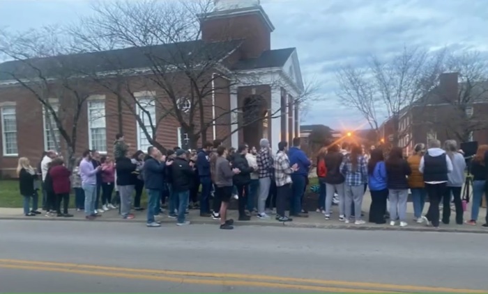 Students from Union College of Barbourville, Kentucky and others gather on the streets for a service on Friday, Feb. 24, 2023. 