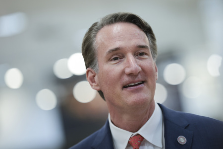 Virginia Gov. Glenn Youngkin answers questions from members of the media after touring an H Mart supermarket while meeting with Asian community leaders on April 06, 2023, in Fairfax, Virginia.