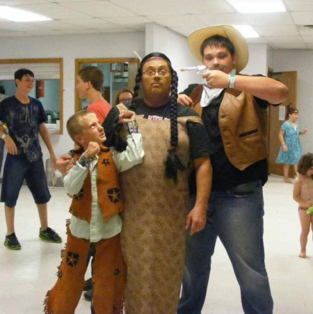 Pastor Sherman Jaquess (C) of Matoaka Baptist Church in Ochelata, Oklahoma, dressed as Native American figure, Pocahontas.