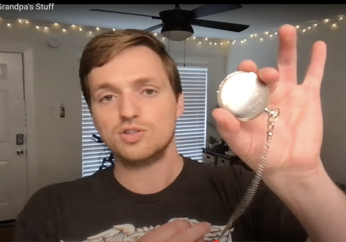 Matt Brodersen holds a photo of his grandfather's watch.