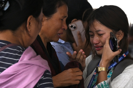 A woman cries as she waits at the airport to flee ethnic violence that has hit the region in Imphal, northeastern Indian state of Manipur, on May 7, 2023. Some 23,000 people have fled ethnic violence in northeast India that has reportedly killed at least 54, the army said On May 7, 2023, although there was no new 'major violence' overnight.