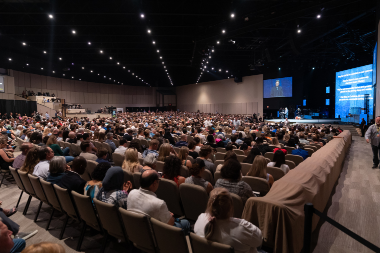 Members of the Allen community mourn the deadly shooting during a prayer vigil at Cottonwood Creek Church.