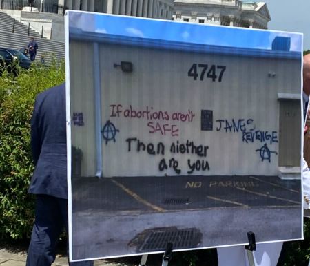 A poster documenting pro-abortion vandalism is displayed at a press conference held after a U.S. House Judiciary Committee hearing on the Freedom of Access to Clinic Entrances (FACE) Act, May 16, 2023. 