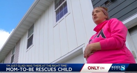 Kyrie Jones, 35, stands outside her town home while being interviewed by KCCI in Des Moines, Iowa, in May 2023. 