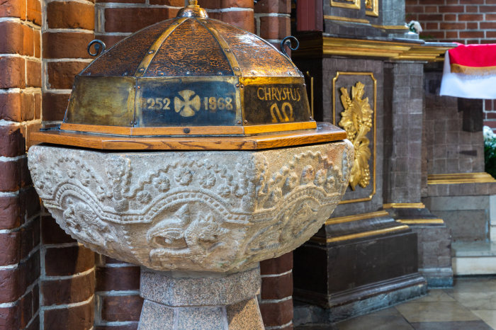 The Romanesque baptismal font inside the Church of St. Nicholas in Grudziadz, Poland. 