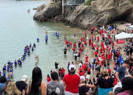 Thousands of people attend a baptism event sponsored by several churches at Pirates Cove, California, on Pentecost Sunday, May 28, 2023. 