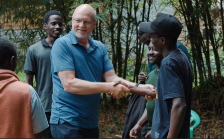 Steve Happ (shaking hands on left), founder of Indigenous Advance Ministries in Uganda. 