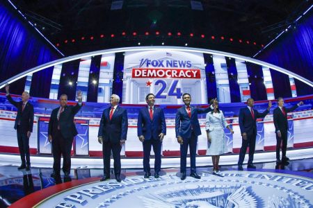 (From L) Former Governor of Arkansas Asa Hutchinson, former Governor of New Jersey Chris Christie, former US Vice President Mike Pence, Florida Governor Ron DeSantis, entrepreneur and author Vivek Ramaswamy, former Governor from South Carolina and UN ambassador Nikki Haley, US Senator from South Carolina Tim Scott and North Dakota Governor Doug Burgum arrive onstage for the first Republican Presidential primary debate at the Fiserv Forum in Milwaukee, Wisconsin, on August 23, 2023. (Photo by KAMIL KRZACZYNSKI / AFP) (Photo by KAMIL KRZACZYNSKI/AFP via Getty Images) 