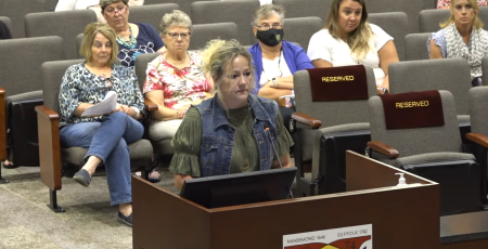 Suffolk resident Angela Kilgore addresses the school board during a public meeting on August 10, 2023. 