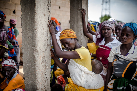 A group of Christian Adara farmers gather at the entrance of a church after the Sunday's service at Ecwa Church, Kajuru, Kaduna State, Nigeria, on April 14, 2019. The ongoing strife between Muslim herders and Christian farmers, which claimed nearly 2,000 lives in 2018 and displaced hundreds of thousands of others, is a divisive issue for Nigeria and some other countries in West Africa.