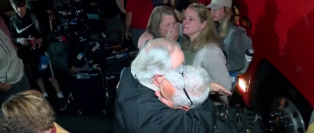 Members of Sunnyside Baptist Church of Kingsport, Tennessee, embrace each other as a tour group safely returns from Israel amid the October 2023 outbreak of war. 