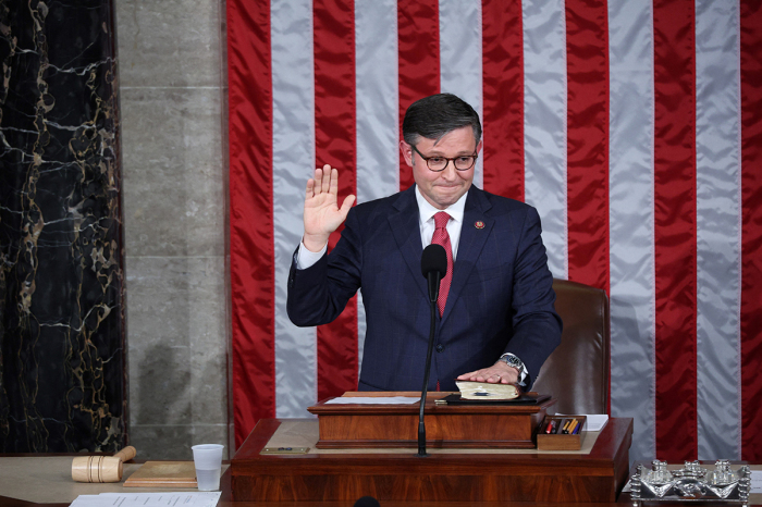 Newly elected U.S. House Speaker Mike Johnson is sworn in at the U.S. Capitol in Washington, D.C., on October 25, 2023. Republicans on October 24 made their fourth pick in just two weeks to replace the ousted speaker of the U.S. House of Representatives, underlining the chaos engulfing the fragmented party after three previous nominees failed to win the gavel. (Photo by TOM BRENNER / AFP) (Photo by TOM BRENNER/AFP via Getty Images)