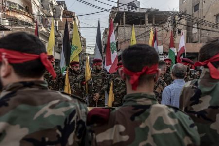 Hezbollah supporters in military clothes in formation within the area where the coffin will be honored moments before the beginning of the funeral of a Hezbollah militant killed by IDF in the Dahieh district of Beirut, Lebanon on on Oct. 23, 2023. Lebanese Hezbollah announced the death of 10 militants this week, bringing to 25 the number killed in its ranks since the large-scale Hamas attack in Israel on Oct. 7. 