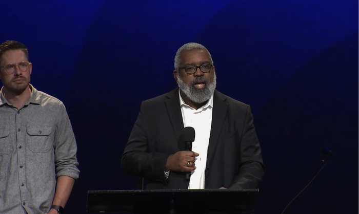 Stuart Greaves (podium), executive director of IHOPKC provides an update on the investigation of founder Mike Bickle at the Forerunner Church on Sunday, October 5, 2023. Forerunner Church lead pastor Isaac Bennett (L) looks on.