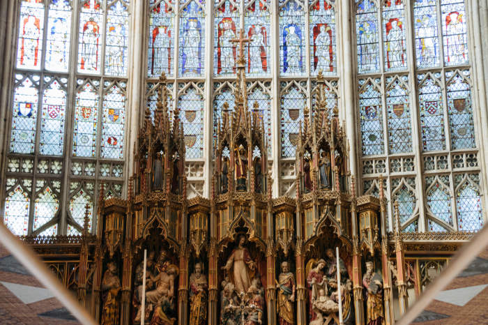 A reflection of the great east window and high altar inside the Cathedral Church of St. Peter and the Holy and Indivisible Trinity in Gloucester, England. 