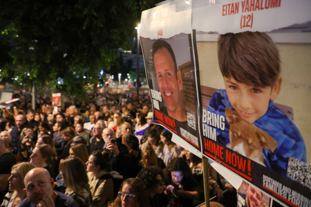 Relatives, friends and supporters of 49-year-old Ohad Yahalomi and his 12-year-old son Eitan, held hostage in Gaza since the October 7 attacks by Hamas terrorists in southern Israel, take part in a protest asking for the release of Israeli hostages in Tel Aviv on November 25, 2023. (Photo by GIL COHEN-MAGEN / AFP) (Photo by GIL COHEN-MAGEN/AFP via Getty Images)