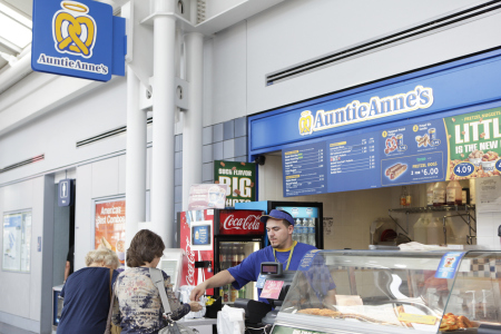 Chicago, USA - September 12, 2011: Travelers shop Auntie Anne's restaurant at O'Hare International Airport. Auntie Anne's has more than 300 franchisees with more than 1,100 locations in the United States and 23 countries.