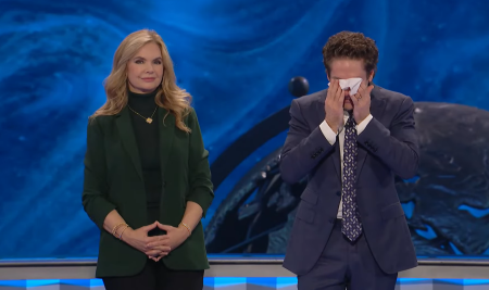 Pastor Joel Osteen (L) of Lakewood Church in Houston, Texas, tears up during his service on January 14, 2024, moments before he announced with his wife, Victoria, by his side that the church had paid of its $100 million loan.