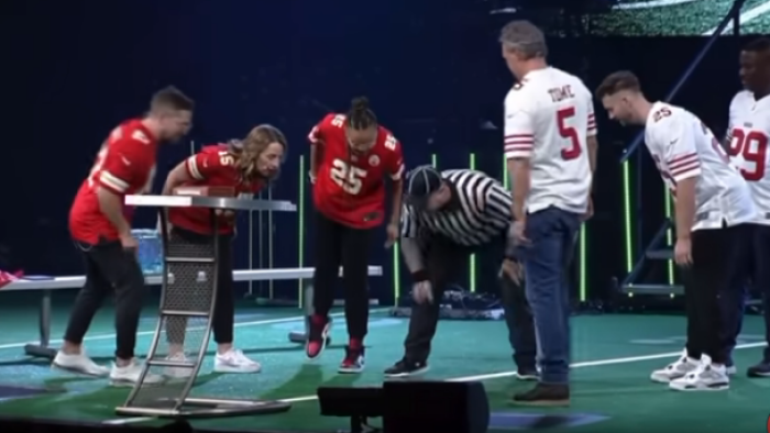 Pastors and other participants await the results of a coin toss ahead of Crossroad Church's 'Super Bowl of Preaching.'