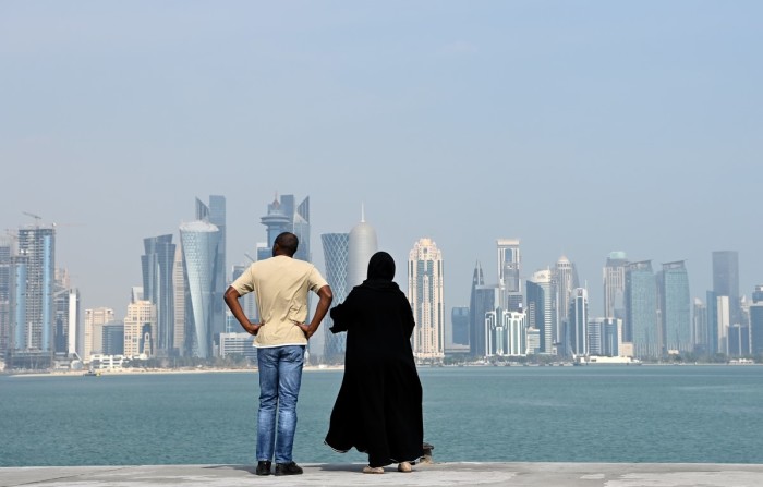 People look at the downtown skyline from the Corniche during the FIFA Arab Cup Qatar on December 15, 2021 in Doha, Qatar. 